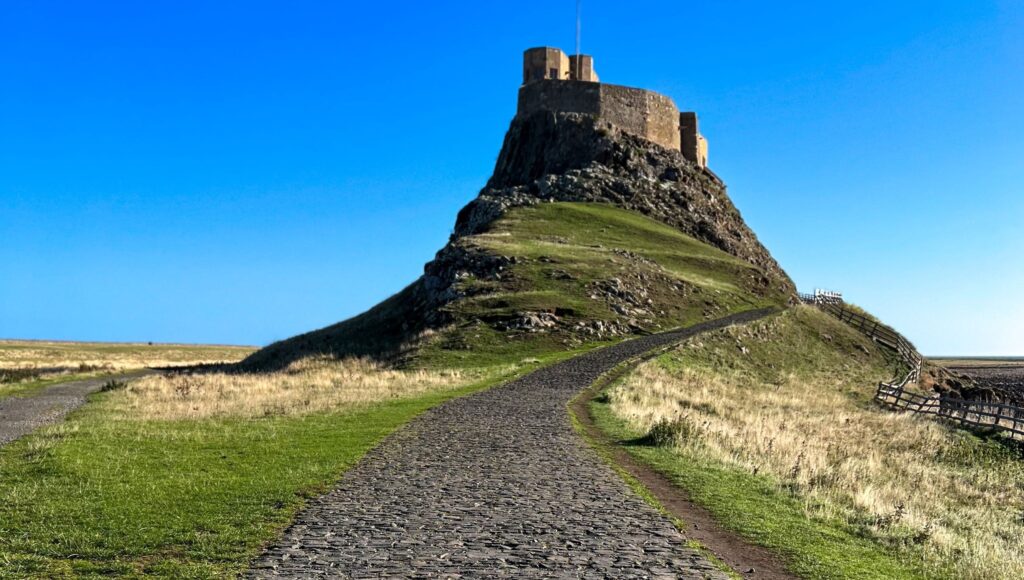 Pilgrimage 2024 IS NOW SOLD OUT But Watch For Upcoming Adventures   Holy Island Cropped Gabe Fender PhYafppWnhE Unsplash 1024x580 